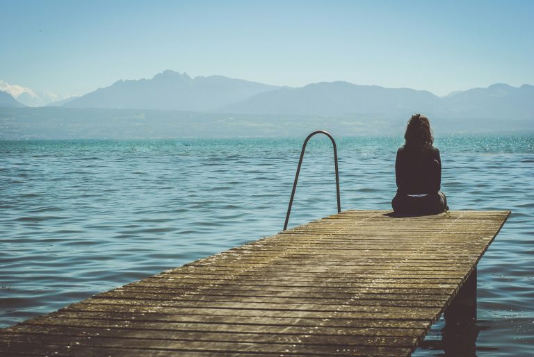 Admiring the lake from a pier