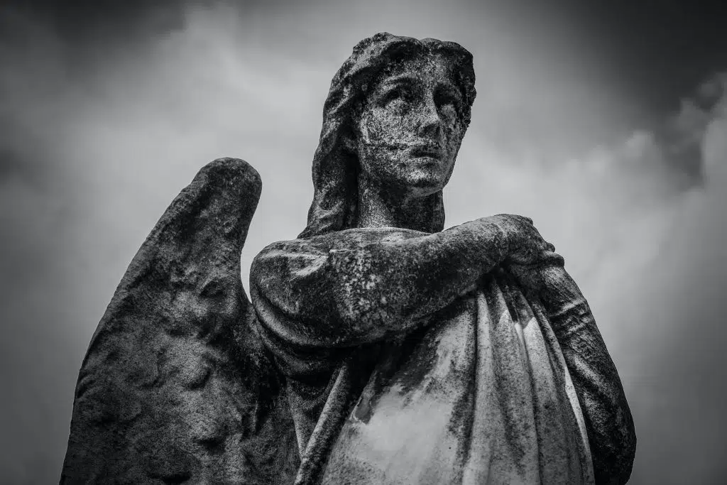 Woman with wings statue grayscale photo