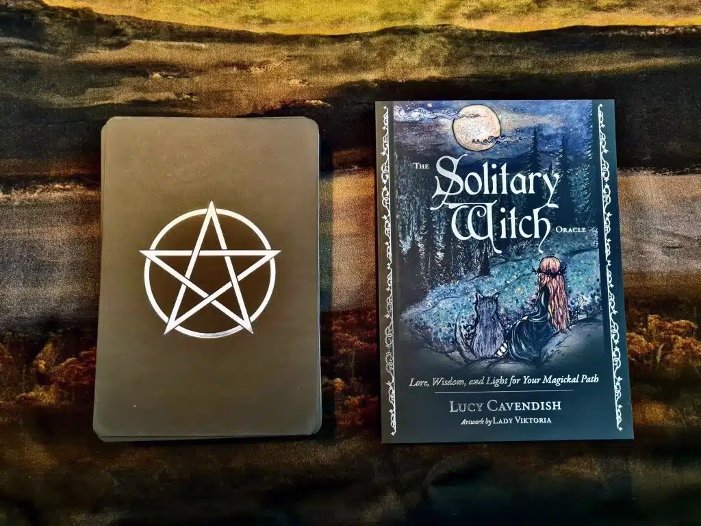 The cards have a clean, simple back with a pentagram.